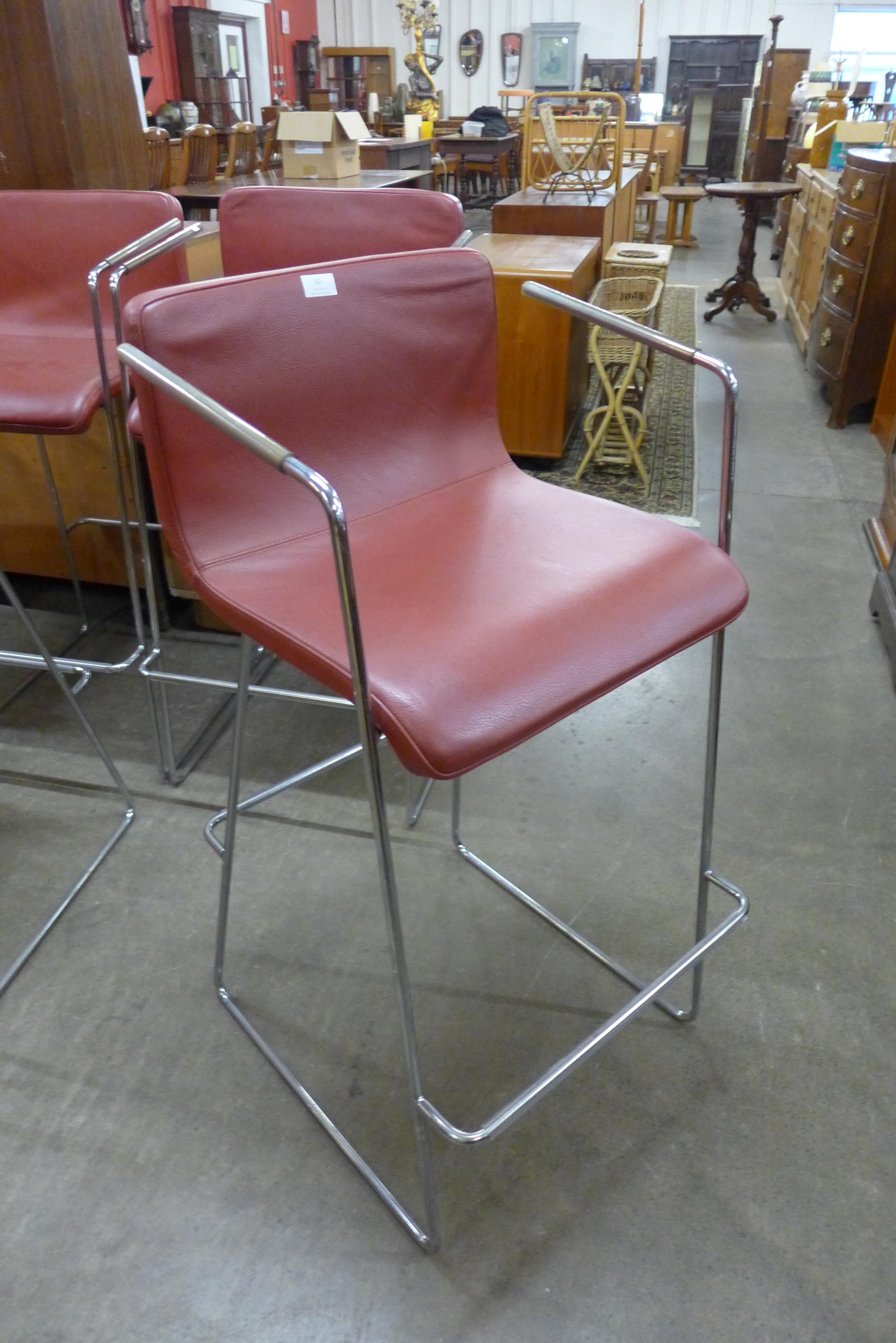 A set of four chrome and red vinyl bar stools - Image 2 of 2