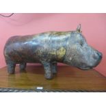A Liberty & Co style brown leather hippopotamus footstool