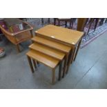 A teak nest of four tables