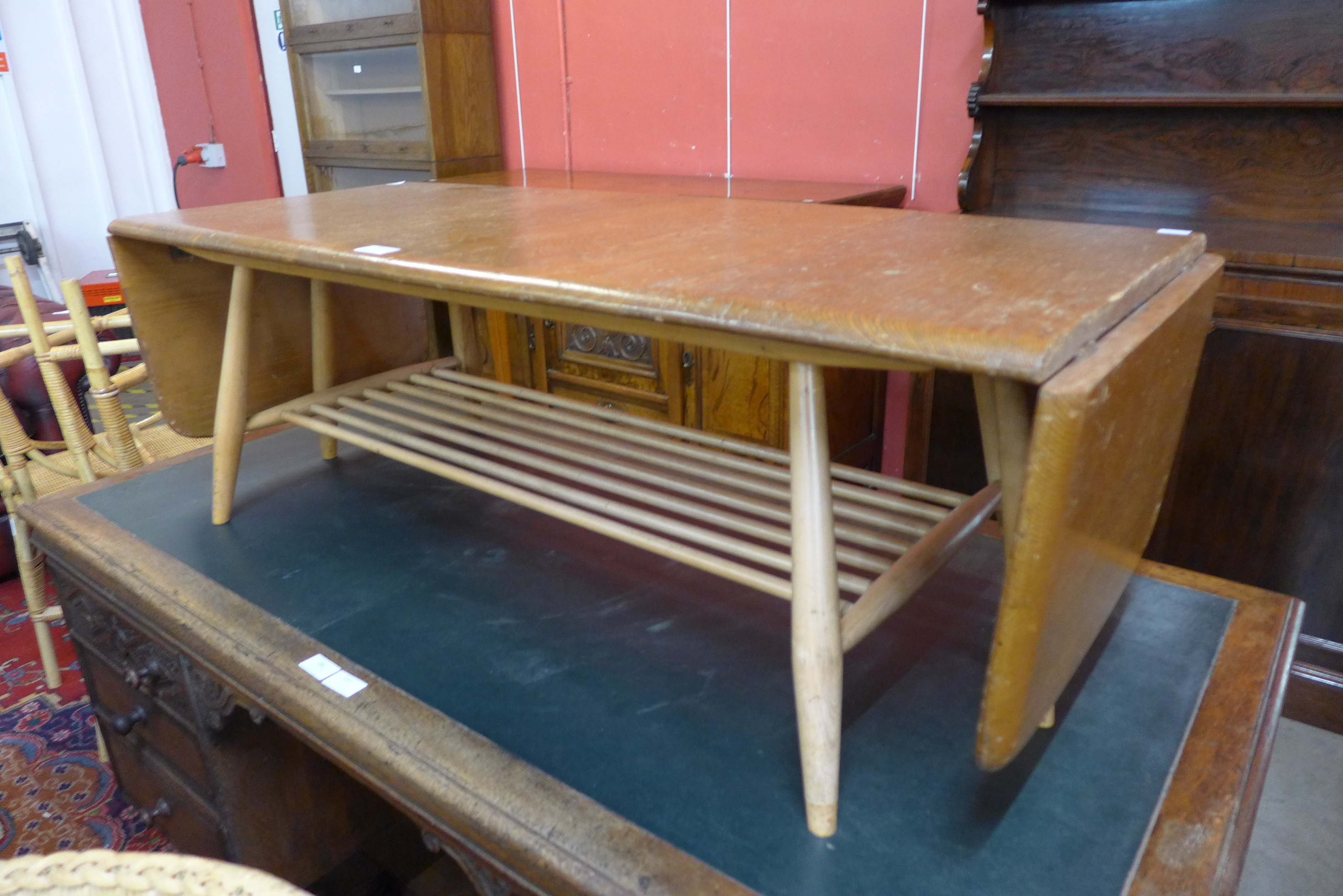 An Ercol Blonde elm and beech drop-leaf Windsor coffee table