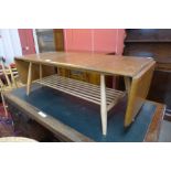 An Ercol Blonde elm and beech drop-leaf Windsor coffee table