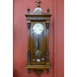 A 19th Century walnut double weight Vienna wall clock