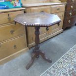 A Victorian oak tripod table