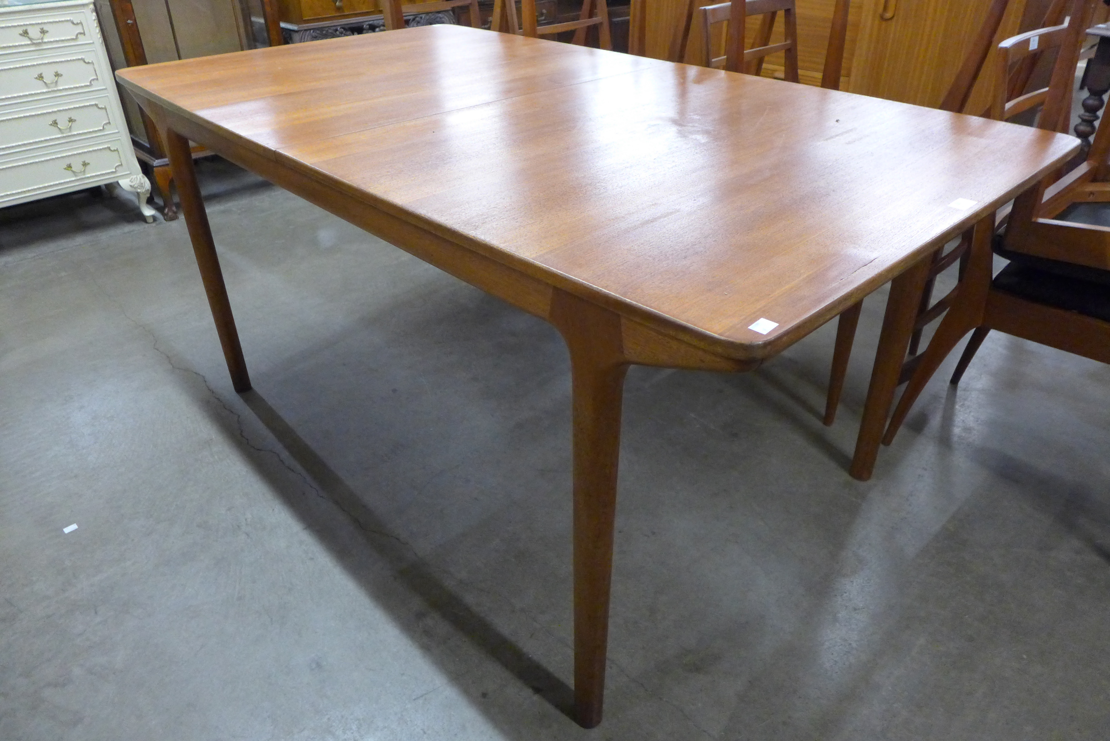 A McIntosh teak T3 extending dining table