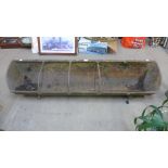 A large cast iron trough