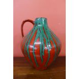 A French 1047 fat lava St. Clement glazed pottery jug
