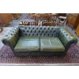 A green leather Chesterfield settee