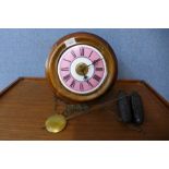 A Victorian circular beech postman's wall alarm clock