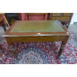 A Victorian mahogany and green leather topped library table