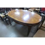 A Chinese oval elm and walnut dining table