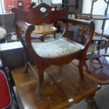 A Victorian style mahogany open armchair