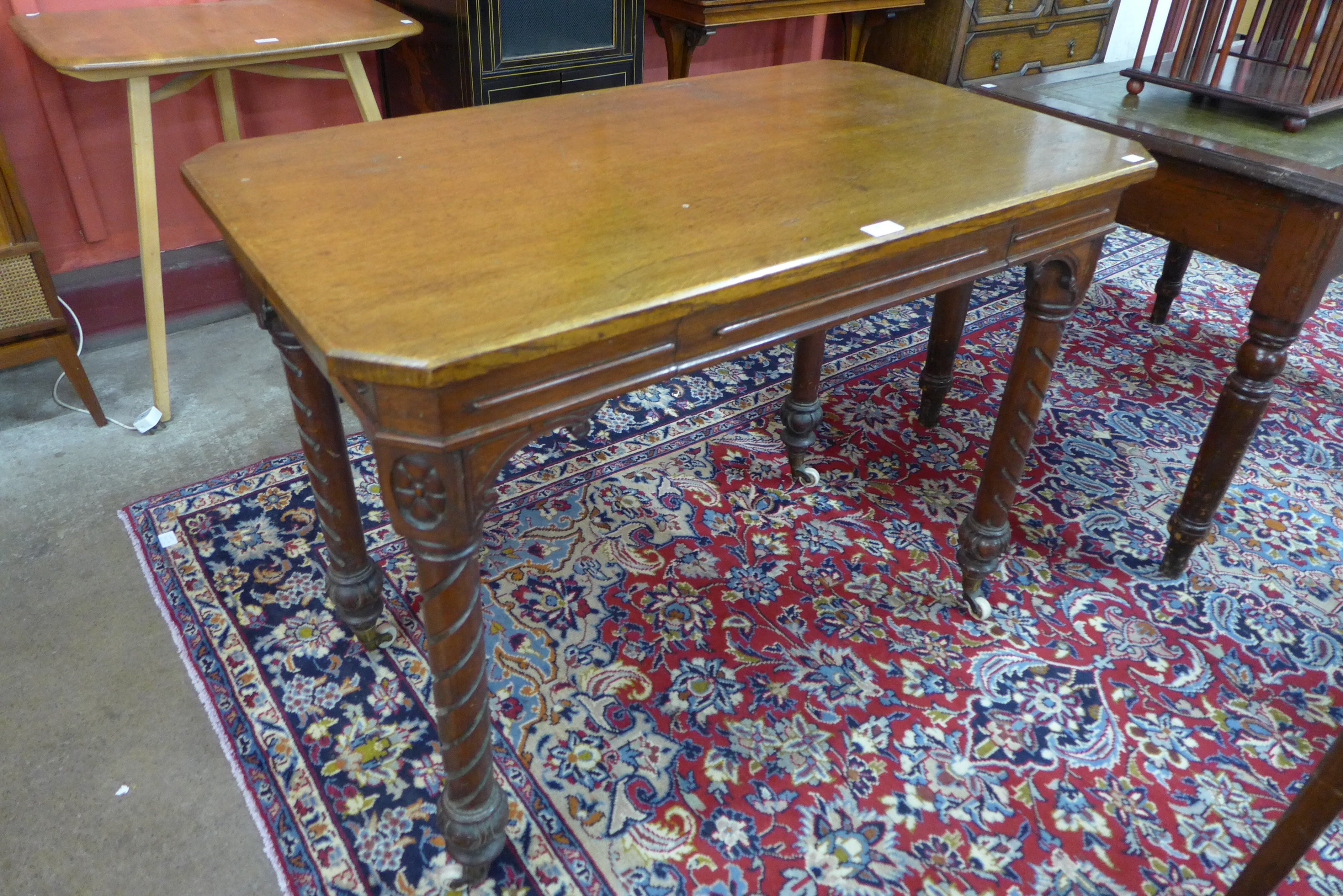 A Victorian Aesthetic Movement oak single drawer writing table