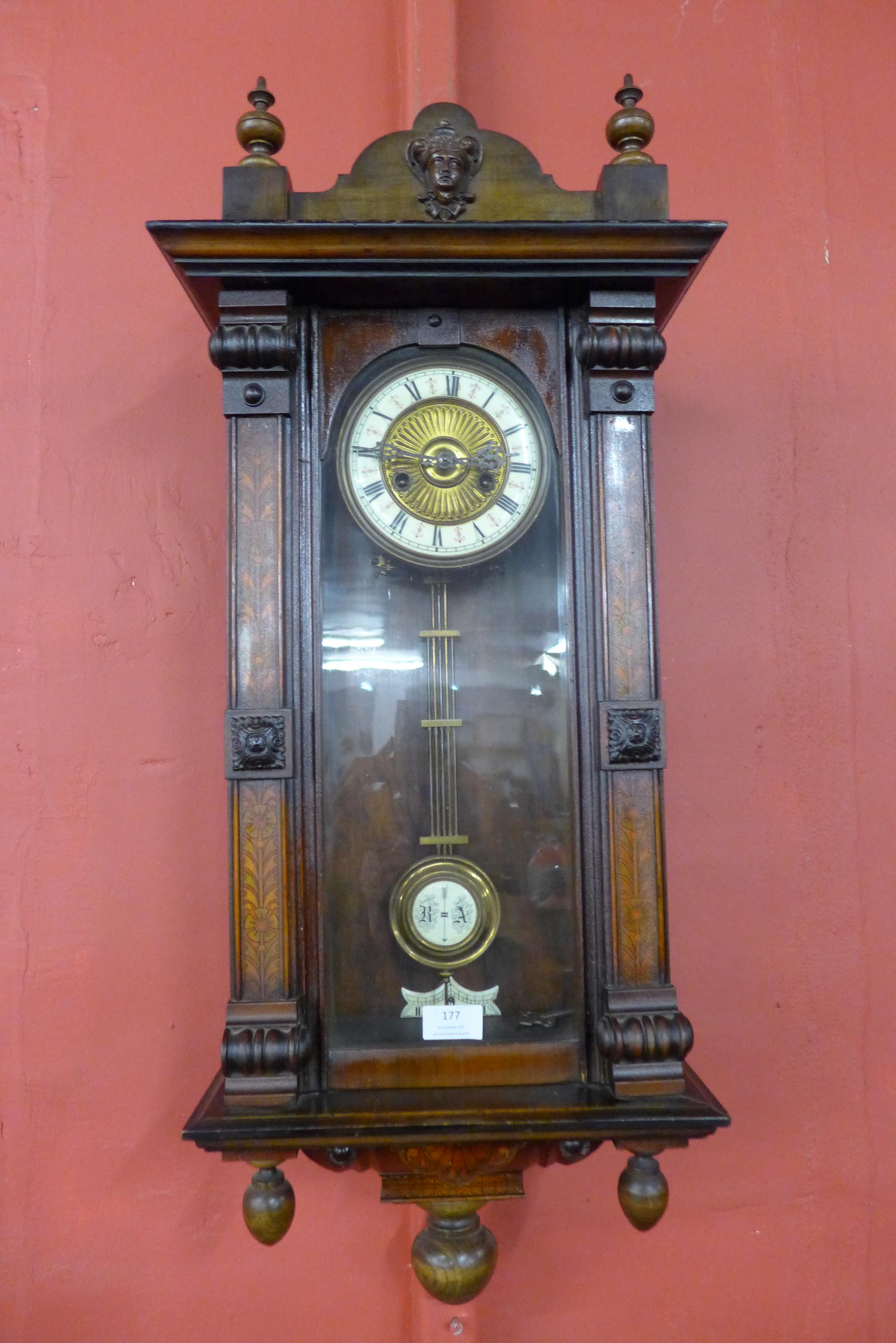 A 19th Century inlaid walnut Vienna wall clock