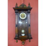 A 19th Century inlaid walnut Vienna wall clock