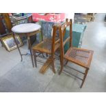 An Edward VII walnut occasional table, two chairs and another table