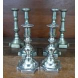 A pair of silver plated and two pairs of pewter communion candlesticks