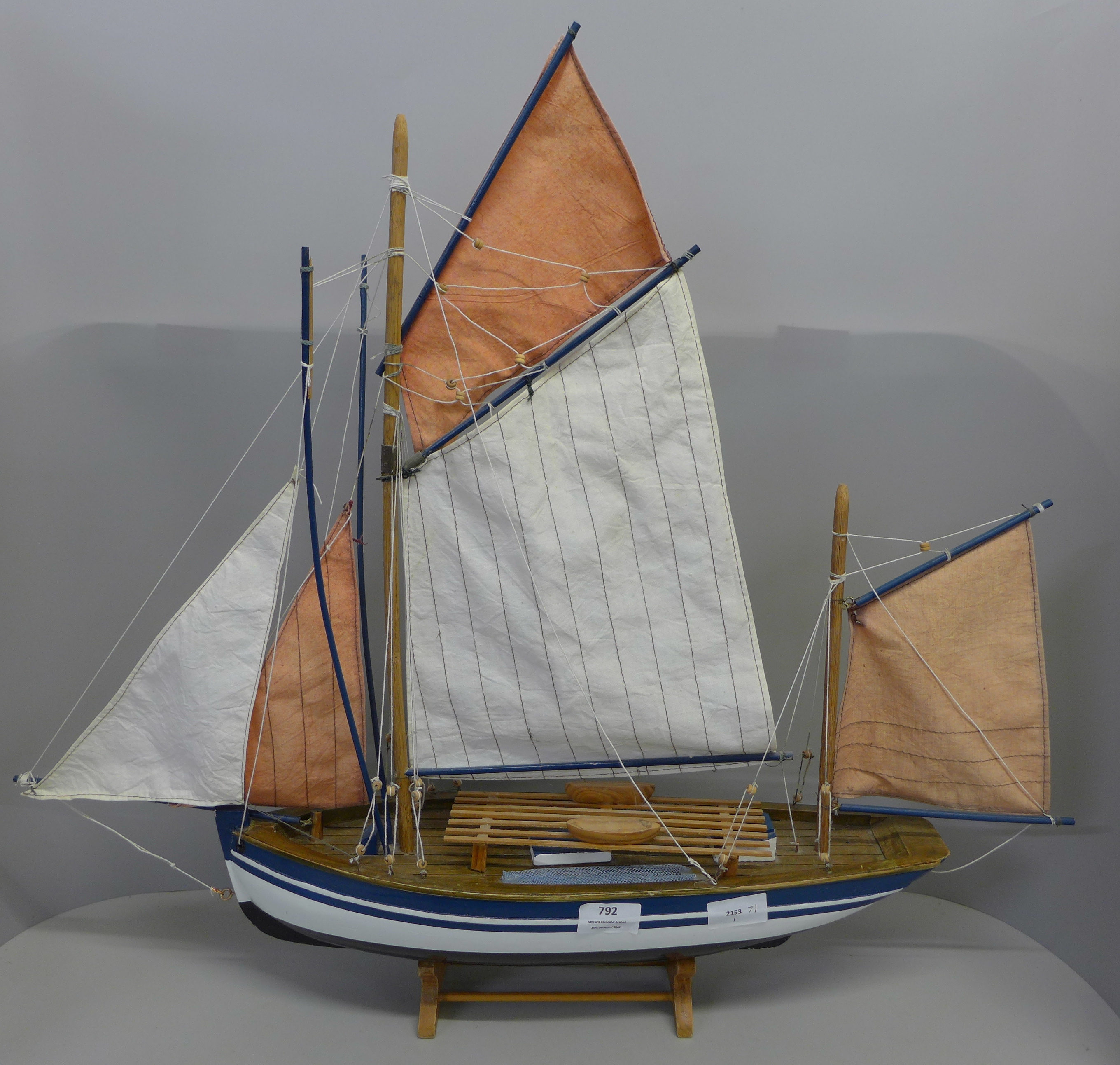 A wooden model of a sailing boat