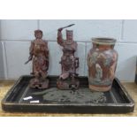 Two carved wooden warrior figures, a dragon decorated tray and a Japanese style vase