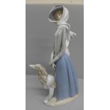 A Lladro figure of a girl with Borzoi