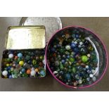 Two tins of marbles **PLEASE NOTE THIS LOT IS NOT ELIGIBLE FOR POSTING AND PACKING**