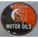 A Red Indian Motor Oils circular enamel sign