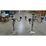 A pair of plated candelabra **PLEASE NOTE THIS LOT IS NOT ELIGIBLE FOR POSTING AND PACKING**