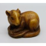 A carved horn netsuke of a rat