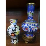 A cloisonne vase on stand and a painted enamel vase