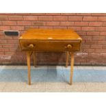 An Ercol elm and beech 437 model desk