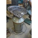 A tractor seat and milk churn bar stool