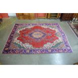 A Persian red ground Isfahan rug, 350 x 243cms