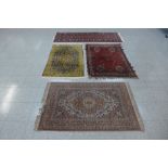 Four assorted rugs