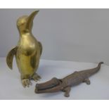 A nutcracker in the form of a crocodile and a brass penguin