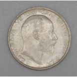 A 1910 one shilling coin, EF