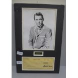 A Gregory Peck autographed cheque and photograph display