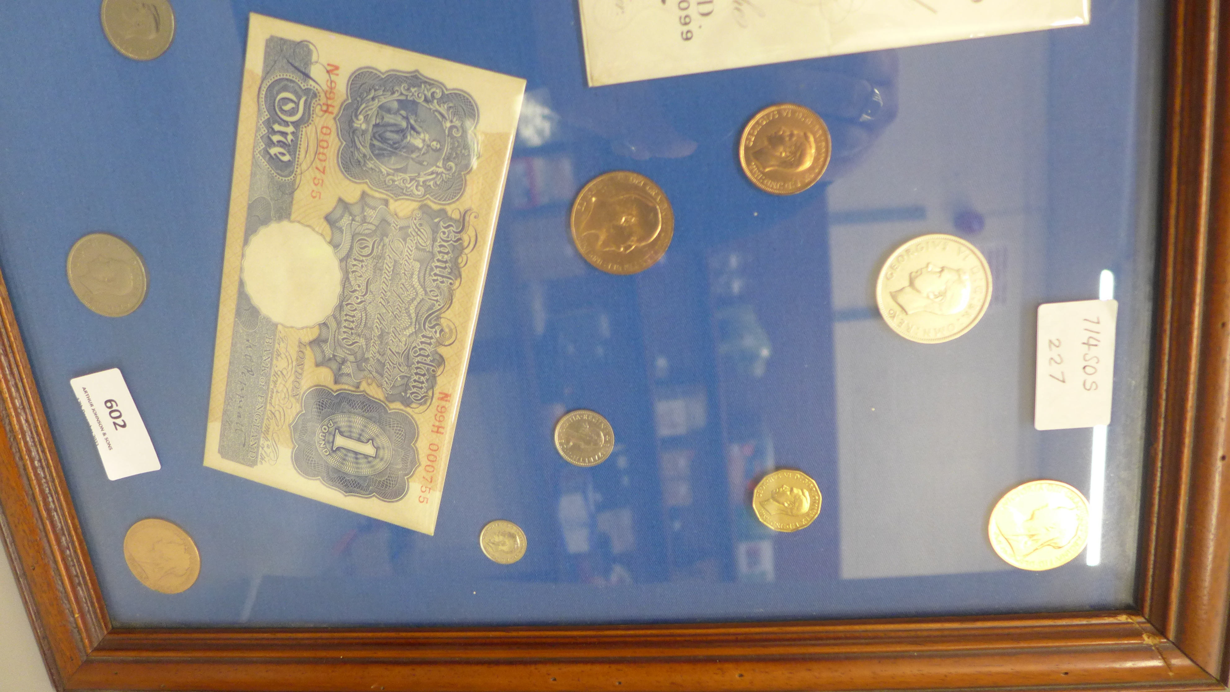 A framed Five Pounds white bank note, two £1 notes, ten shillings note and other coins - Image 2 of 4