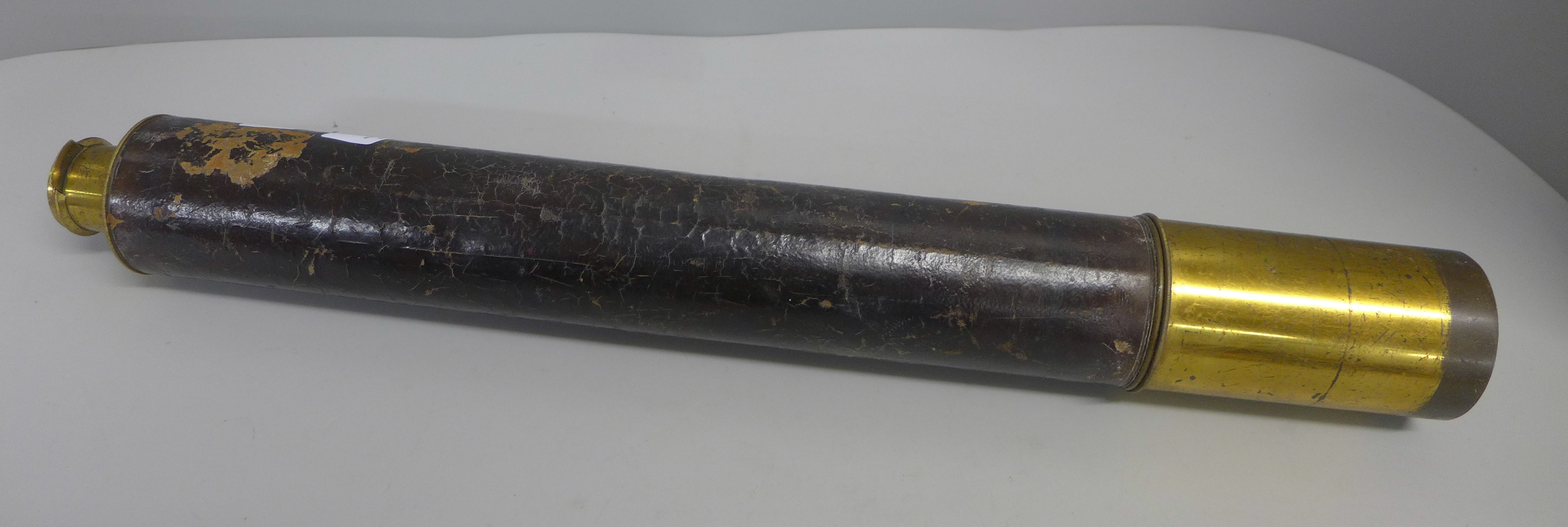 A brass and leather covered telescope, marked Stebbing, Southampton