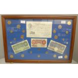 A framed Five Pounds white bank note, two £1 notes, ten shillings note and other coins