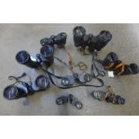 Eight pairs of binoculars including six cased