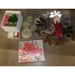 A large stainless steel fruit bowl, a boxed Christmas tree and decorations, two candle holders,