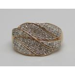 A 9ct gold ring pave set with approximately eighty diamonds, 3.8g, S