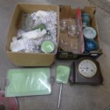 A collection of glassware, a Bakelite clock, and a dressing table set