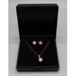 A 9ct gold and pink stone pendant and chain with matching earrings