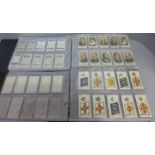 Two albums of Wills and other cigarette cards; famous people, Army equipment, military honours
