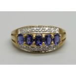 A 9ct gold, fourteen stone diamond and tanzanite ring, 2.4g, P