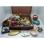 A box of costume jewellery, cufflinks and a Hollywood pill box, plus three gemstones, ruby, sapphire