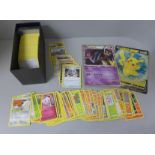 200+ Pokemon cards with dice, coins, protective sleeves and two large cards