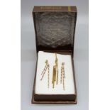 A 9ct gold pendant and chain and a pair of similar earrings, 4.7g