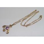 A vintage Art Nouveau 9ct gold, amethyst and seed pearl pendant and chain, 6.7g