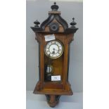 A walnut and ebony small Vienna wall clock